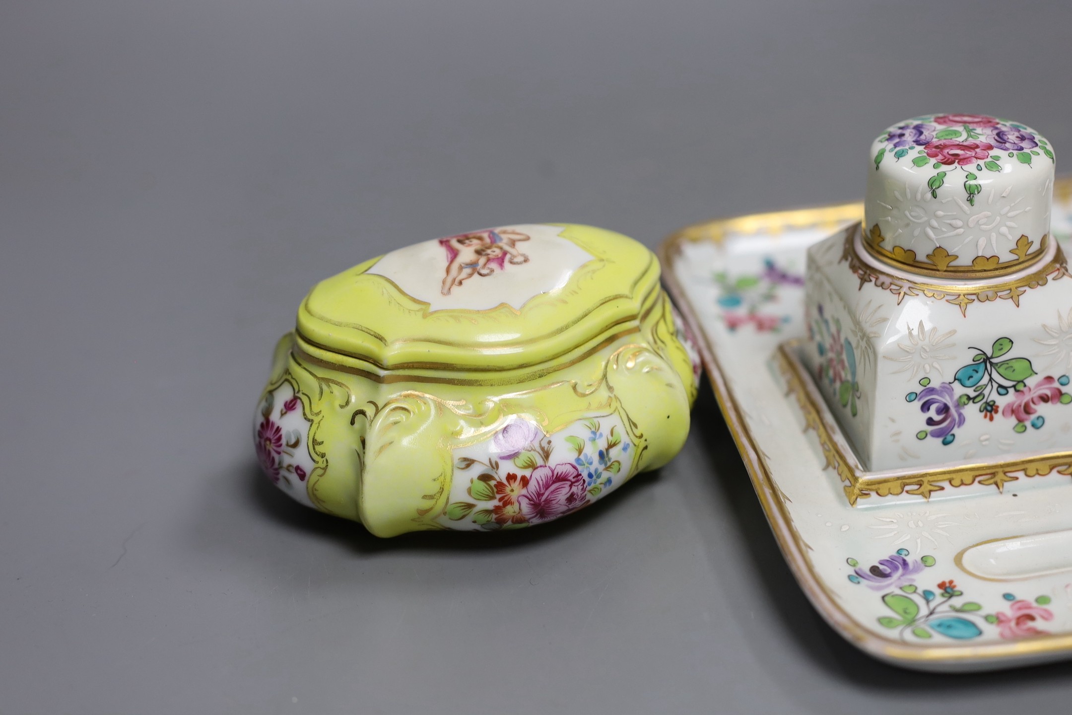 A Samson Paris inkstand and a porcelain box and cover and a porcelain model of a Scots terrier, inkstand 26cms wide